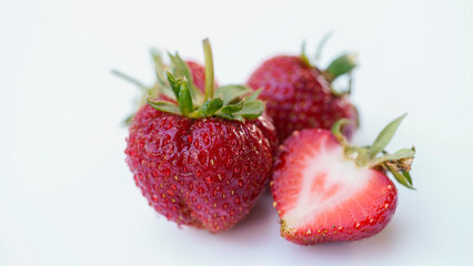 Red strawberries on white wooden table