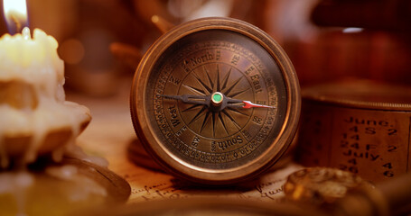 Vintage style travel and adventure. Vintage old compass and other vintage items on the table.