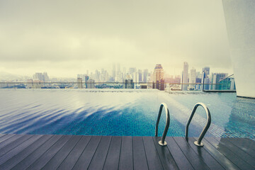 Swimming pool on roof top with beautiful city view. Kuala-Lumpur, Malaysia.