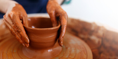 Master making a pot on pottery wheel,banner