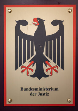 Coat of arms of Germany and lettering on a building of the German Federal Ministry of Justice