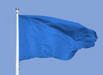 Close up of blue flag with sky background and copy space