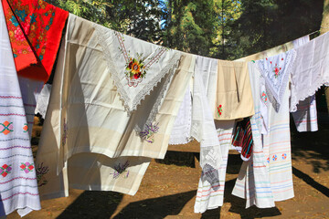Linen tablecloths, towels, napkins  decorated with embroidery and lace. - 577962945