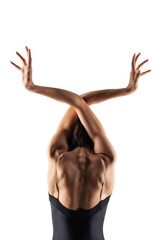 Modern ballet dancer posing on white background. Elegant lady making beautiful body sculptures. © Nikola Spasenoski