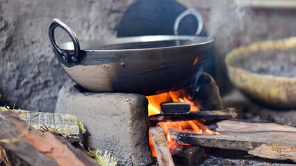 Cooking Pan over wooden fire used to cook food at village in India
