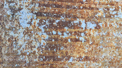 A metal plate with red rust and blue paint. Background and texture