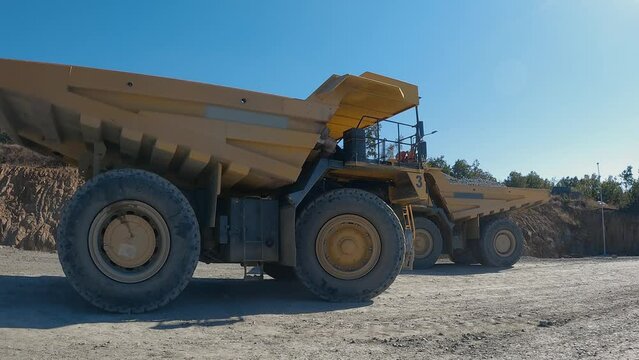 Mining dumper truck mining machinery transport ore from open-pit, slow motion