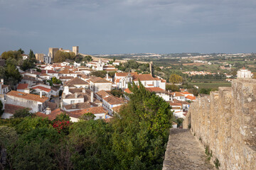 Fototapeta na wymiar Walls of Obidos with view over the old town and surrounding countryside, Obidos, Central Region, Portugal, Europe