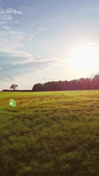 Social media nature background, beautiful grassland and shining sun, clouds, vertical short video
