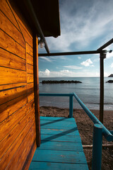 Wooden cottage and teh Chiaiai beach, Procida.