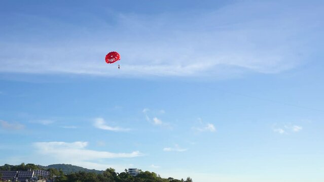 Parachute parasailing hanging in the air sky. adventure feelings travel summer.