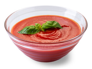 Glass cup with tomato puree sauce with basil leaves
