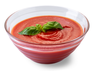 Glass cup with tomato puree sauce with basil leaves