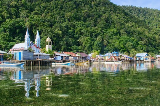 Beautiful scene of Yenbekwan village with the church - Mansuar Island, Raja Ampat, West Papua, Indonesia