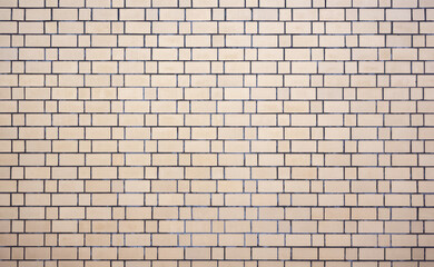 a beige ceramic tiled wall texture