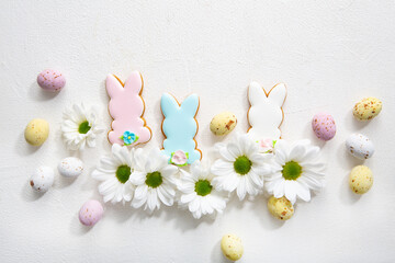 Overhead view of Easter bunny cookies holiday concept chocolate eggs