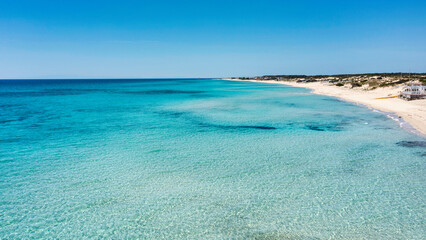Sea and beach aerial view. A beautiful beach with white sand and  crystal clear water - Salento, Apulia, Taranto, Italy