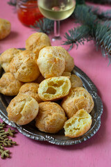 French fluffy savoury cheese puffs gougeres for cocktails - 577988323