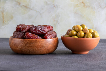 Dates fruit and green olives,traditional iftar table
