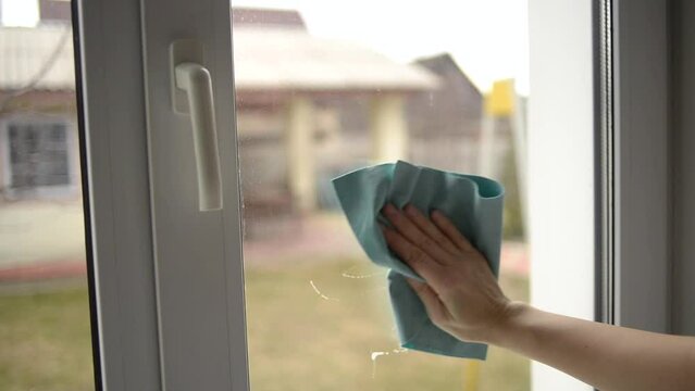 Close-up of hand cleaning windows. Cleaning services