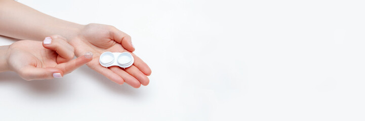 Contact Eye Lenses. Woman Hands Holding Contact Eye Lens. Woman Hands Holding White Eye lens Container. Beautiful Woman Fingers Holding Eye Lens Box. Health And Eye Care Concept. high resolution. 