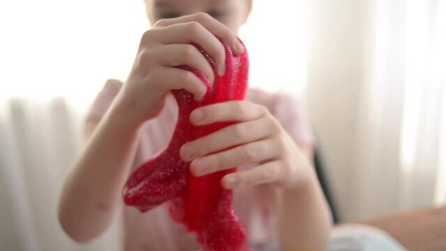 child playing with slime
