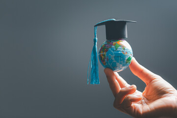 Graduation cap with Earth globe. Concept of global business study, abroad educational, Back to...