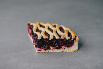 Delicious blueberry pie isolated on gray stone background..