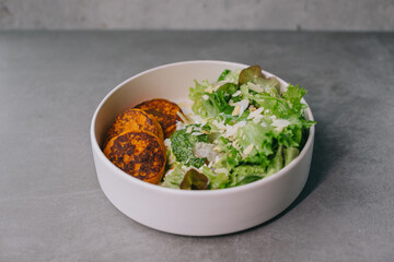 Food on an elegant white plate, lunch or dinner dish. Delicious food in a restaurant close-up.