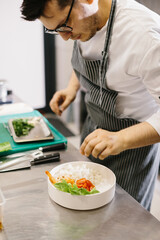 Cropped view of chef preparing food, food, in kitchen, chef preparing food, chef decorating dish, close-up