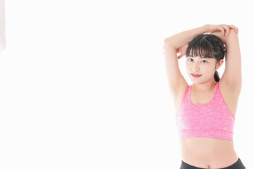 ウォーミングアップをする若い女性