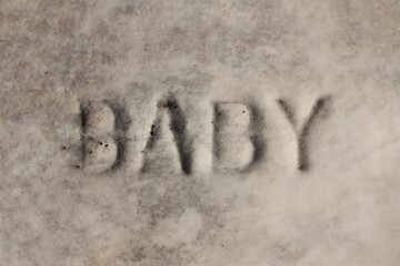 Fototapeta premium Baby written on a vintage tomb.