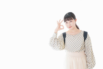 グッドサインをする笑顔の女子学生