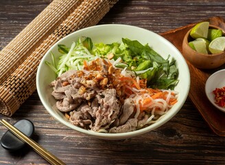 Mixed Beef jerky with rice noodles Fish sauce served in bowl isolated on table top view of taiwan food