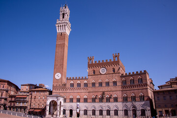 Piazza del Campo (Campo square), Palazzo Publico and Torre del Mangia (Mangia tower) in Siena, Tuscany, Italy
