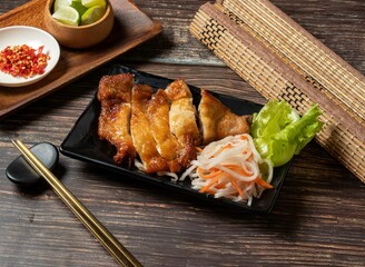 fried chicken slice with noodle served in bowl isolated on table top view of taiwan food