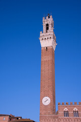 Fototapeta premium Piazza del Campo (Campo square), Palazzo Publico and Torre del Mangia (Mangia tower) in Siena, Tuscany, Italy