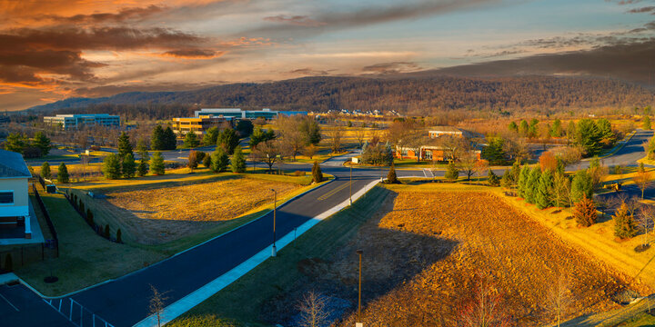 Tranquil Spring Sunrise Landscape And Dramatic Cloudscape Over The Center Valley, Buildings And Street In Allentown, Pennsylvania, USA, Change Of Season At The Green Field From Winter To Spring