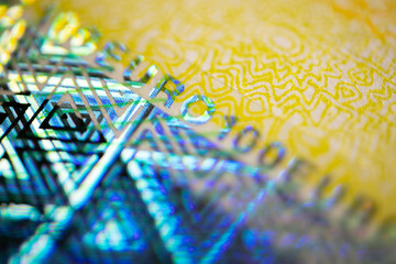 One hundred euro banknote. Euro money macro close-up. Individual details of the European Union's Euro cash, with a face value of one hundred euros. Saving for financial freedom concept.