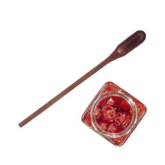 Pickled pepper in a glass jar with wooden spoon. Isolated in a top view.