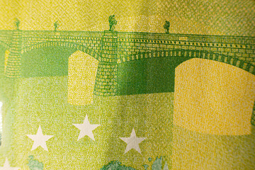 One hundred euro banknote. Euro money macro close-up. Individual details of the European Union's Euro cash, with a face value of one hundred euros. Saving for financial freedom concept.