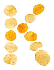 Letter K made of potato chips and isolated on png transparent background. Food alphabet concept. One letter of the set of potato chip font easy to stacking.