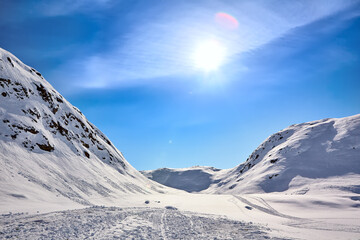 Arctic landscape of East Greenland with mountains and sun - 578024943