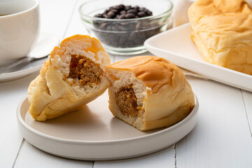Half sliced Freshly baked Dried shredded pork filled Soft and fluffy bread,Pieces of bun stuffed...