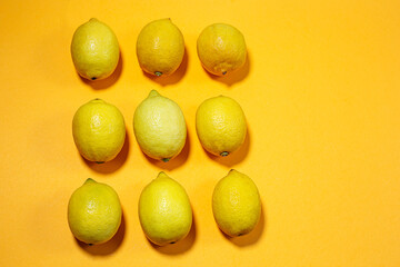 Nine different lemons pattern shape on yellow background, copy space, isolated 