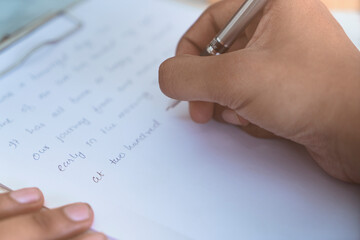 close up of hand with pen
