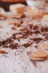 Obraz na płótnie Canvas Cookies and dry tea leaves on a kitchen table