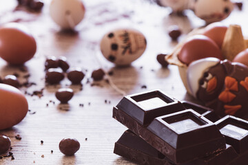 Chocolate bar and Easter eggs in the background