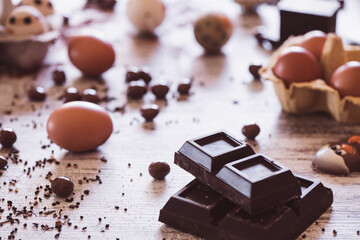 Chocolate bar and Easter eggs in the background