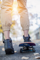 Female skater enjoys riding and jumping with her skate